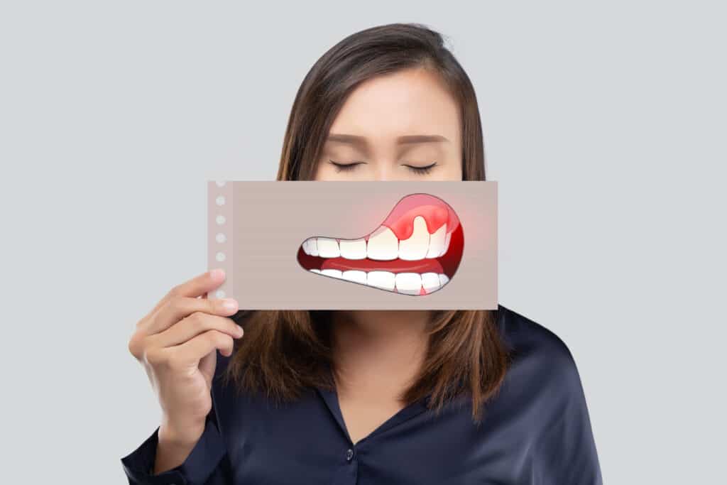 a women holding gum disease paper module