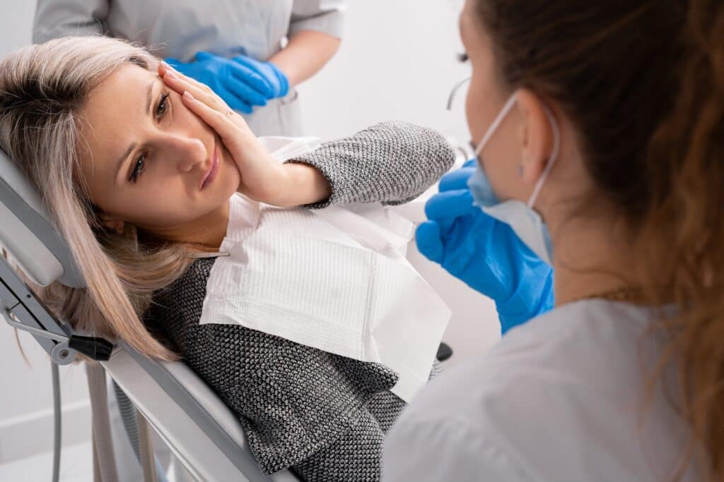 a young girl surfing tooth pain